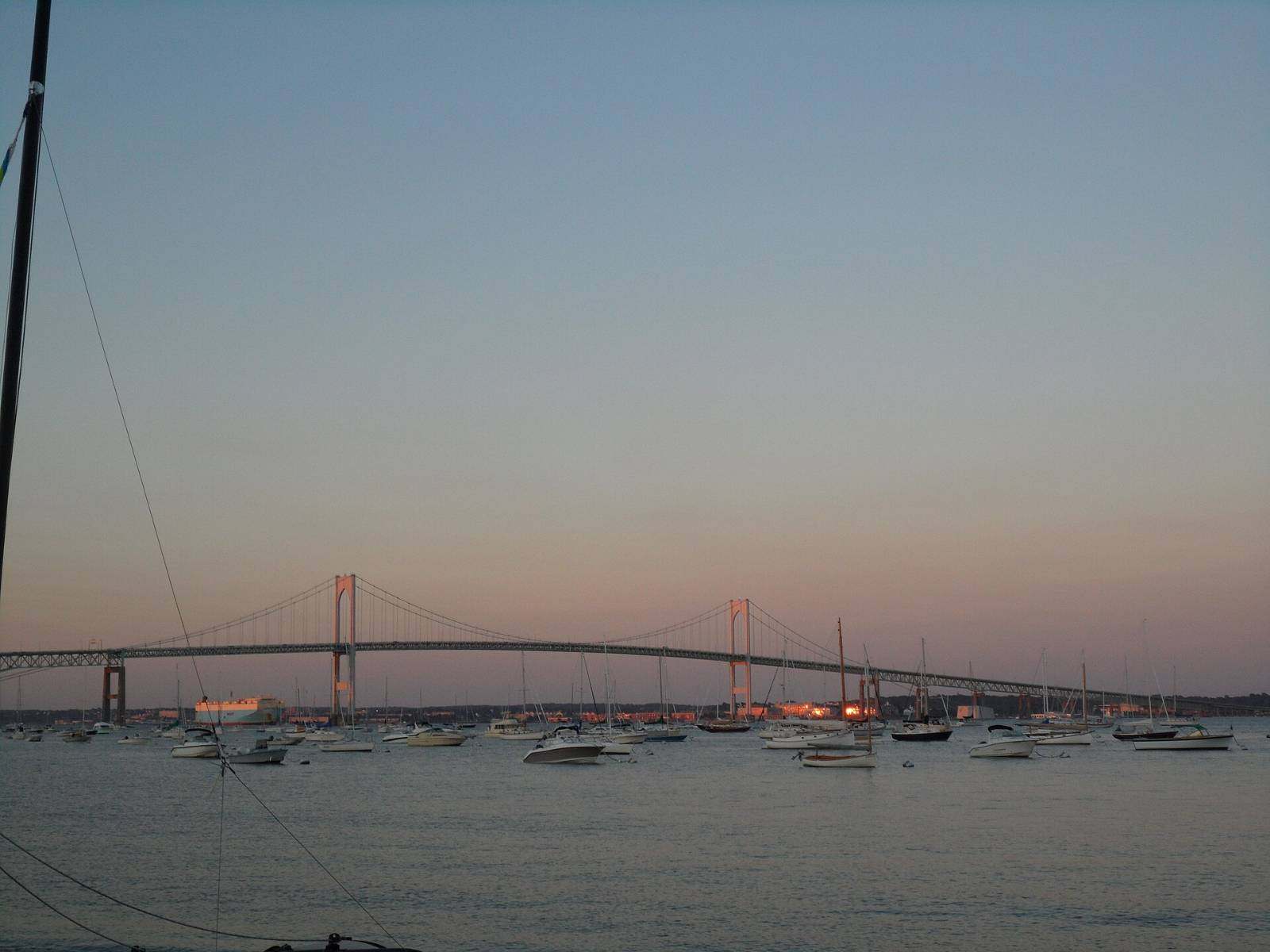 Sunset over Newport Harbor with the Claiborne Pell Bridge in the distance